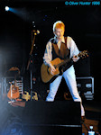 Bruce playing acoustic guitar